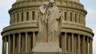 The statue of Grief and History stands in front of the Capitol Dome in Washington.