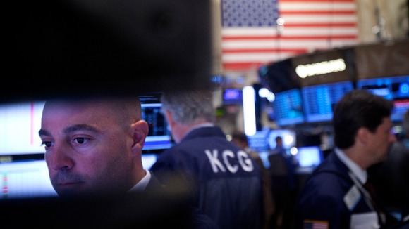 Traders work on the floor of the New York Stock Exchange