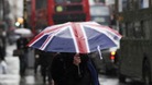 Woman walking with umbrella