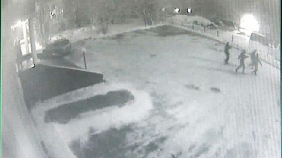 Four of the masked intruders, captured on CCTV.