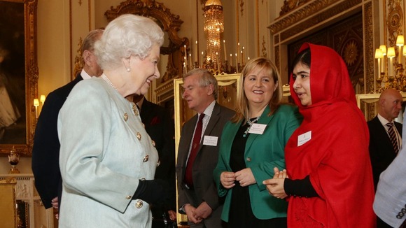 The Queen talks to Malala at the Buckingham Palace reception on Friday.