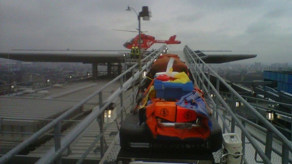 The Air Ambulance on top of the Royal London Hospital this afternoon