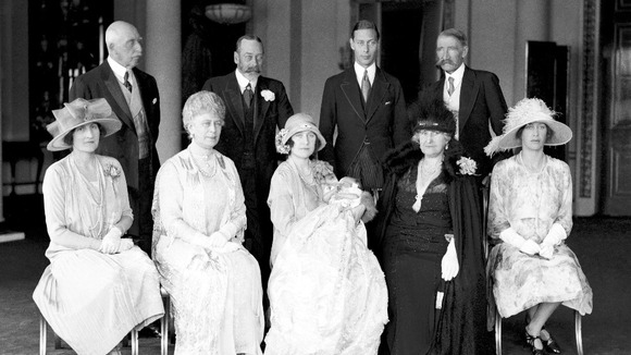 The Duchess of York, (later the Queen mother) holds Princess Elizabeth surrounded by family and dignitaries on May 1, 1926.