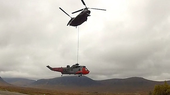 The Chinook transferred the Sea King to a waiting low loader.