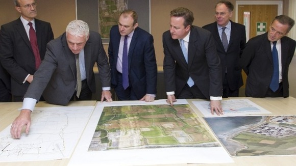 Ed Davey and David Cameron are shown site plans for Hinkley C