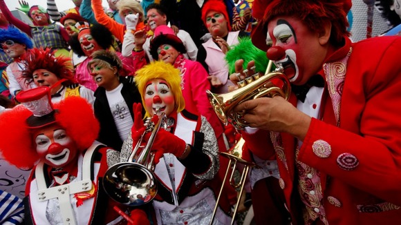 Clowns play music as they rally for peace during the 18th Latin American clown convention