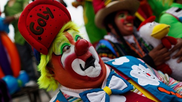 "Goly" the clown laughs for fifteen minutes during a rally for peace