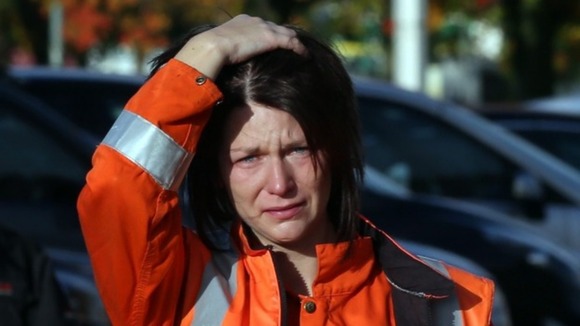 A worker leaves Grangemouth oil refinery in Falkirk following yesterday's closure