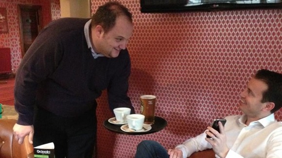 Landlord Adrian Clarke delivers orders placed by the app