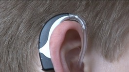Young person with a hearing aid