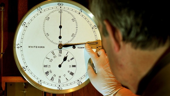 Horologist Francis Brodie checks one of the 500 working clocks in the Science Museum