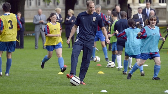 Prince William plays football at Buckingham Palace recently.