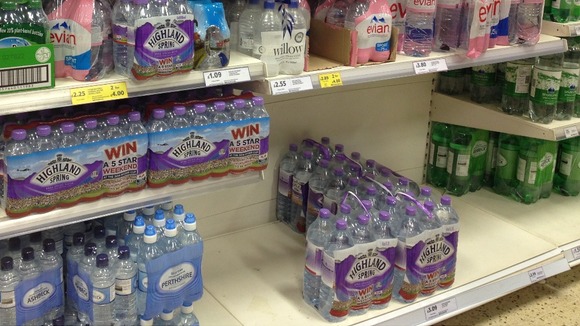 Much of the stock of large bottles of water has gone at the Tesco in Spring Hill