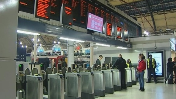 Commuters at London's Victoria Station this morning.
