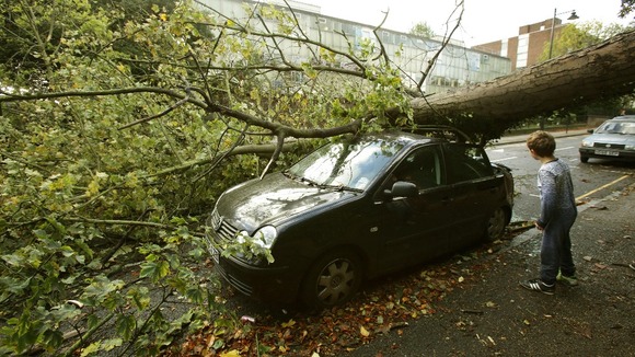 A child takes in the scene in Hornsey.