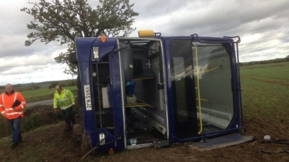 A double-decker bus "rolled over" in Suffolk, injuring the driver and several passengers.