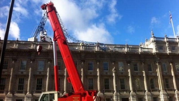 A second crane has been moved in to help remove the remnants of a damaged one on the roof of the Cabinet Office