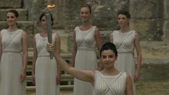 The "high priestess" lights the Olympic flame.