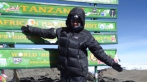 Milly Pyne at the top of Mount Kilimanjaro