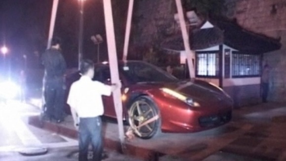 Ferrari 458 Italia being lifted from the ancient wall