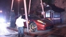 Ferrari 458 Italia being lifted from the ancient wall