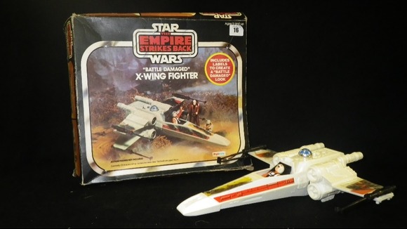 Retro: A 'Battle Damaged' X-Wing Fighter being sold in the lot.
