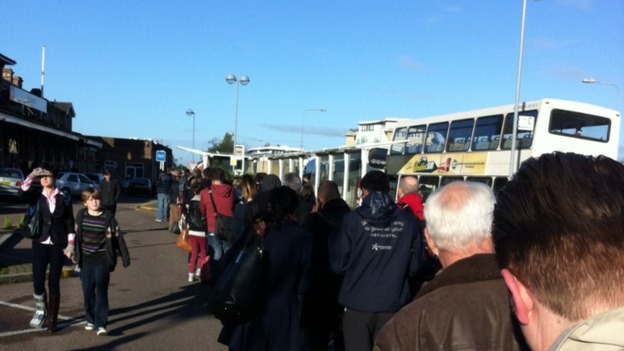 Passengers wait for buses at Ipswich railway station.