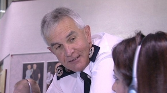 Peter Fahy talking to colleague