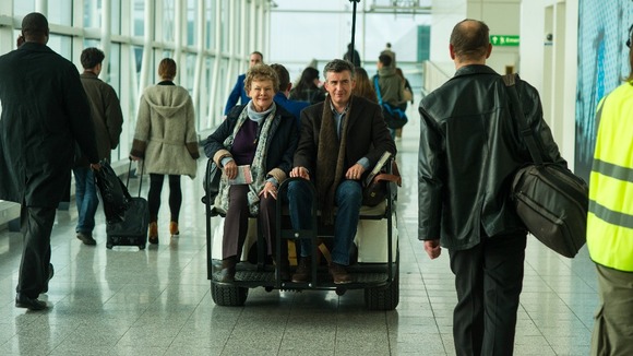 Dame Judi Dench and Steve Coogan during filming at Stansted