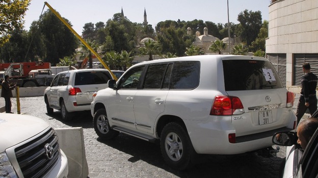 OPCW weapons inspectors, seen here in a convoy in Damascus, have verified 21 of 23 sites declared by Syria