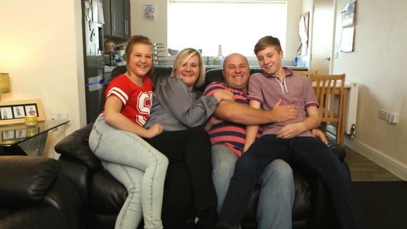Family pose on sofa