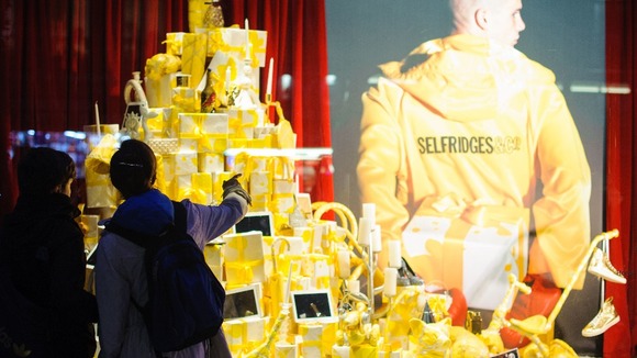 Shoppers eye presents in London's Selfridges store on Oxford Street.