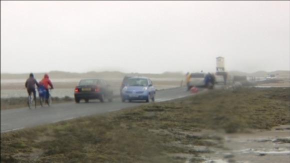 Cars passing the film set