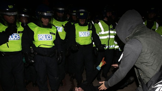 Protestors clash with police outside Buckingham Palace, as they demonstrate during the Bonfire of Austerity protest in central London.