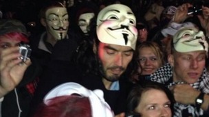 Russell Brand pictured with an Anonymous mask during the Million Mask March.