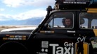 A Staffordshire man and two friends took a taxi ride round the world t raise moneu for the Red Cross