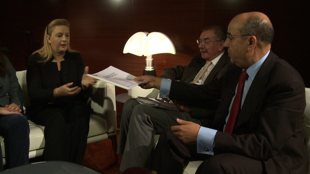 Yasser Arafat's widow Suha being presented with the forensic report.
