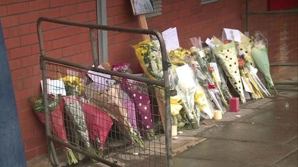 Tributes outside Luton police station