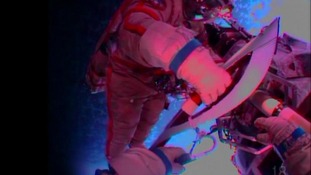 Russian cosmonauts took an Olympic torch into open space for the first time in history today
