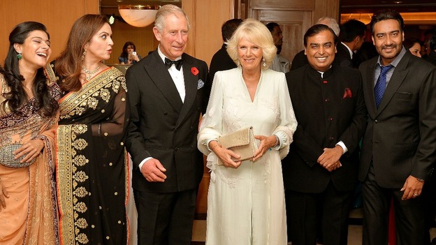The pair with billionaire Mukesh Ambani (second right), his wife Nita (second left) and Kajol Devgan (left) and husband Ajay (right)
