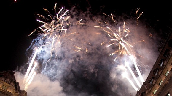 Christmas blast off: Fireworks mark the switching on of the Regent Street lights tonight.