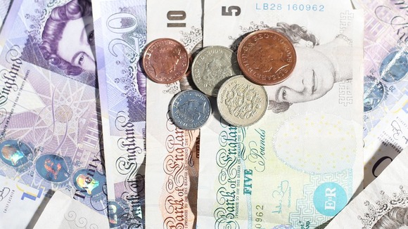 File photo of coins and notes.