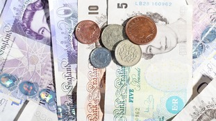 File photo of coins and notes.