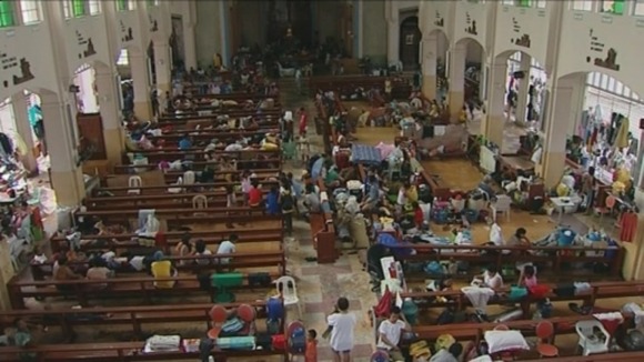 The pews of a Catholic Church in central Tacloban are being used as hospital beds