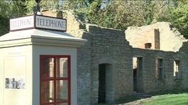 The telephone box still stands in Tyneham, most of the building are in ruins