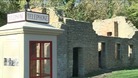 The telephone box still stands in Tyneham, most of the building are in ruins