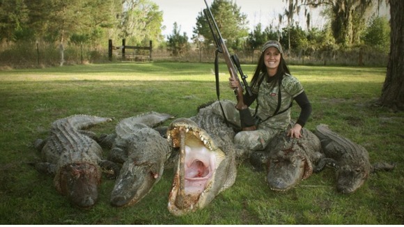 Bachman posing with apparently dead aligators