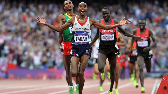 Mo Farah celebrates one of two gold medals in London last summer.