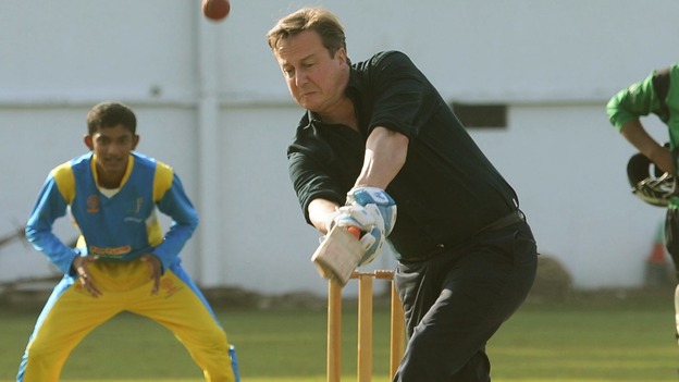David Cameron faces the bowling of Sri Lankan cricketer Muttiah Muralitharan