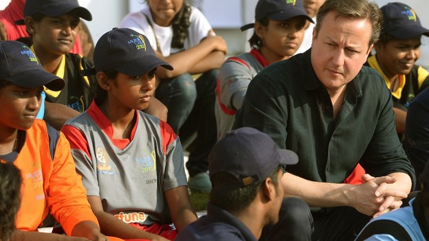David Cameron chats to youngsters at the charity run by Muttiah Muralitharan